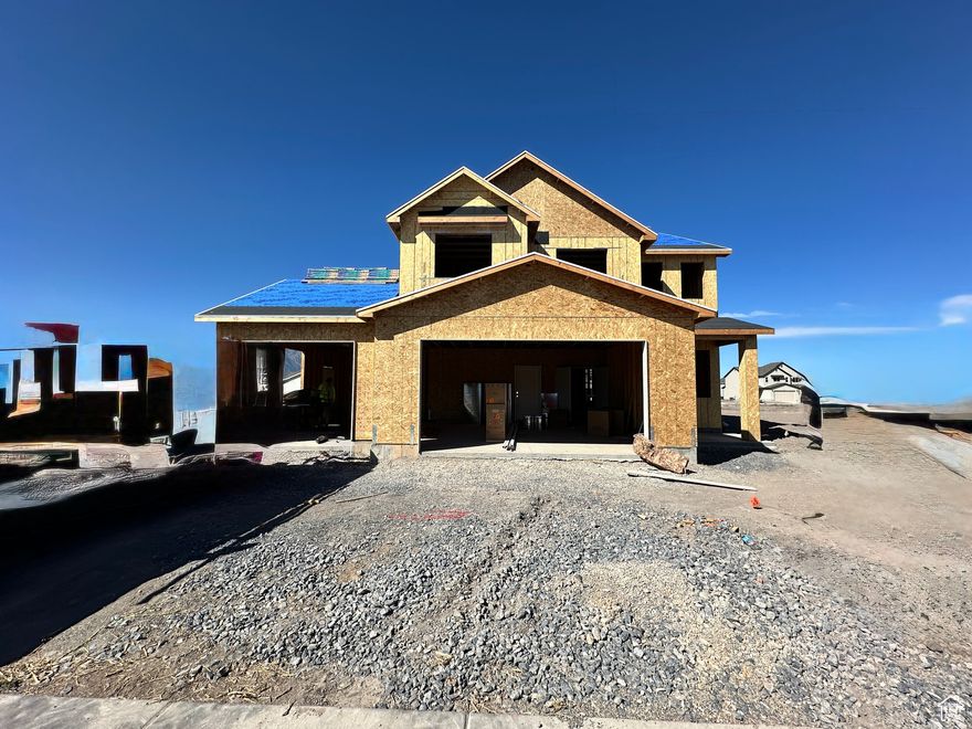 The Santa Anna Floor Plan, a 2-story home with 3-car garage located in Nibley's Firefly Estates Community. Main level offers 9-foot ceilings and an open floor plan with luxury vinyl plank flooring throughout. The kitchen features granite countertops, large, single basin sink, & white, ceiling height cabinets with rustic alder island. Upstairs, you'll find all bedrooms conveniently placed with laundry room nearby. The owner's suite includes tray ceiling, spacious walk-in closet and beautiful bathroom with separate tub/shower. Estimated Completion: Dec 5, 2025. *some photos are of a similar home with slightly different floor plan and different color selections.