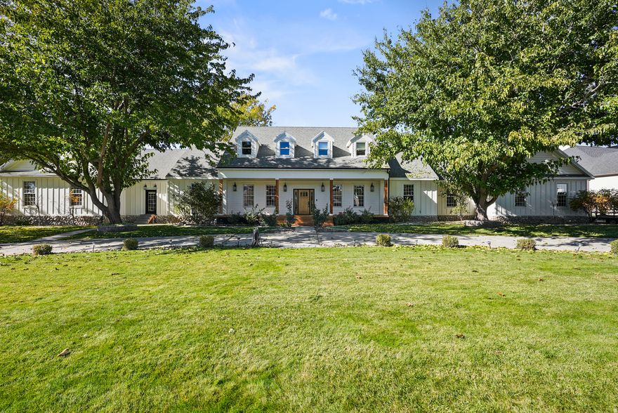 Welcome to this exceptional equestrian property set on 1.47 beautiful acres! This property offers panoramic mountain views and refined amenities. This spacious executive estate offers inviting living areas filled with abundant natural light and comprises seven well-appointed bedrooms and five bathrooms. The primary suite is complemented by a private sitting area, adjoining nursery and a luxurious en suite bath with direct hot tub access, providing a tranquil escape.  The remodeled kitchen is equipped with high-end Wolf appliances, a Sub-Zero refrigerator, custom cabinetry, granite countertops, exposed wood beams, an elegant brick backsplash, and a functional butler's pantry, ideal for culinary enthusiasts and entertaining.  The grounds are thoughtfully configured for equestrian use, offering fenced pastures and extensive riding areas set against the picturesque Wasatch Front mountain range. The acreage allows for further customization, with potential to add a pool or pickleball courts, making it a versatile canvas for future enhancements. The private backyard, including large deck and pergola covered patio, creates an inviting atmosphere for relaxation or gatherings, enhanced by remarkable vistas in all directions.  Located within the sought-after Bonanza Acres neighborhood, this estate offers convenient proximity to the South Jordan Equestrian Center, local schools, parks, shopping, and dining options. It harmoniously combines comfort, convenience, pastoral living, and extraordinary natural scenery.  Prospective buyers are invited to schedule a private tour to fully appreciate the exceptional lifestyle and features this distinguished 1.47-acre horse property provides.  Square footage figures are provided as a courtesy estimate only. Buyer to verify all.