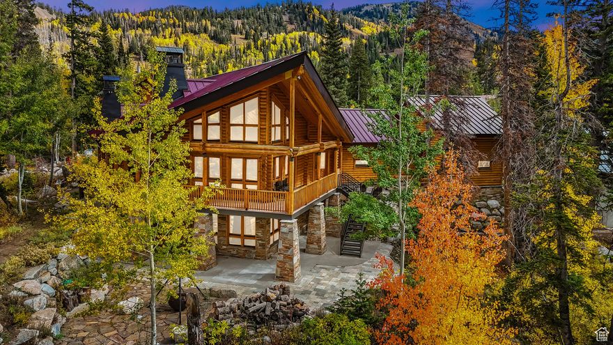 Welcome to this turn-key mountain retreat on the coveted Brighton Loop, offering breathtaking mountain and forest views. Enjoy year-round access on a large, low-maintenance lot with Cottonwood Creek, an outdoor spa hook-up, and a cozy raised fire pit for evenings under the stars. Close to Brighton Resort and Silver Lake for skiing, hiking, biking, and fishing. Inside, a vaulted great room with a dramatic rock fireplace anchors the home, joined by a chef's kitchen with Viking appliances & granite. The main-level primary suite features its own fireplace, steam shower, jetted tub, walk-in closet, and a fireplace in the main bath. Upstairs, a spacious loft with private deck offers stunning views. The walk-out lower level adds a second kitchen, recreation room with fireplace, sauna, and guest suites. Relax on the rear deck or use the heated 3+ car (1,100 sq ft) garage w/220V. Fire sprinklers, instant hot water, new roof & serviced boiler (2025), and zoned heating complete this rare find.  Buyer to  verify all MLS information including square footage and all details as part of their due diligence.