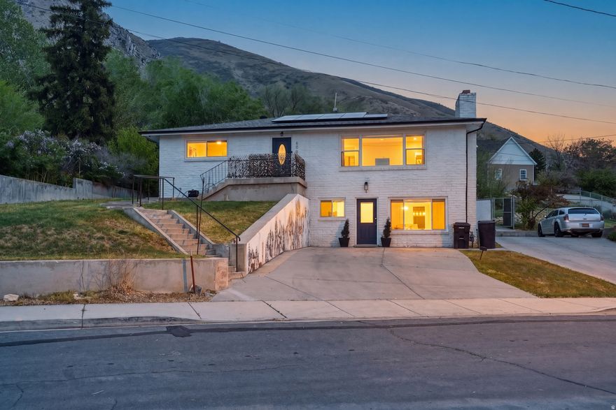 Beautifully remodeled home on Springville's east bench, perfectly suited for owner-occupiers or investors with an active fully furnished Airbnb/VRBO operating from the finished basement - a turnkey way to enter the vacation rental market. There is a financial history showing 25-27k each year in income! This could also be used as a Mother-In-Law apartment or for multi-generational living. Perched on a .4-acre terraced mountainside lot, the property offers incredible valley and mountain views and plenty of outdoor space for playing, entertaining, or watching deer wander through the peaceful, quiet neighborhood. Inside, a large, highly functional kitchen and a spacious living room with a big front window and welcoming front porch make sunset-watching effortless, while bathrooms showcase higher-end finishes for a luxurious feel. The home is move-in ready with almost all plumbing and electrical replaced, roof updated in 2019 when solar was installed, new water heater in 2023 and AC was replaced in 2018. Properties with this kind of potential don't come around often. Make your appointment to see this one today! Square footage figures are provided as a courtesy estimate only and were obtained from County records. Buyer is advised to obtain an independent measurement.