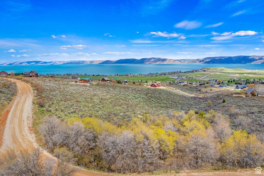 Beautiful north sloping lot with expansive and protected views of Bear Lake and the valley. This lot captures everything Bear Lake has to offer. From the incredible sunrises/sunsets over the lake, direct access to hundreds of groomed trails in the Cache National Forest system and beach access through Ideal Beach. Come build your Bear Lake Getaway today. No short term rentals allowed.