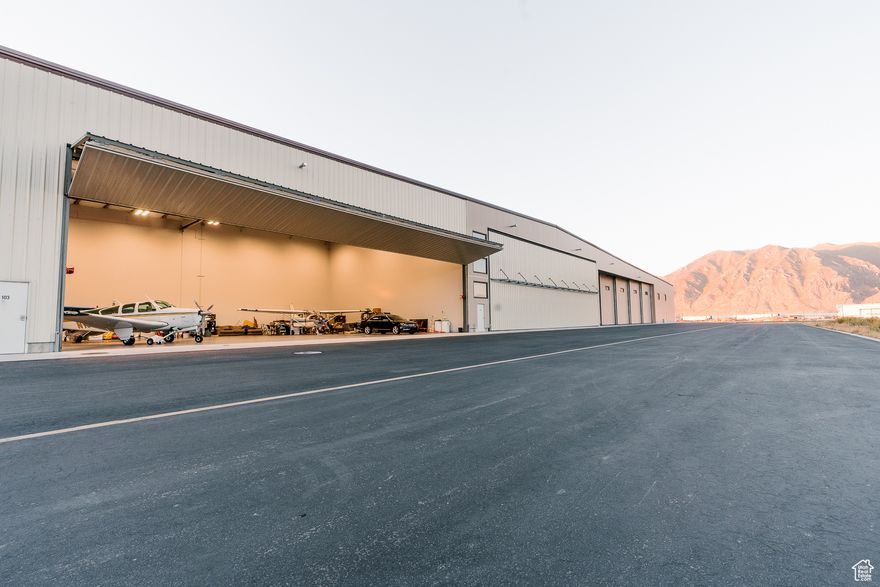 80' x 60' Hangar with 70' x 18' Schweiss Bi-Fold Door.  Built in 2021, this hangar Features:  Epoxy flooring and bright LED lighting  Multiple electrical outlets and hose bib, Gas ceiling radiant heat,  Insulation  Drywall, textured walls, and fresh paint,  Bathroom with tiled shower and ventilation fan,  Plumbed for a future kitchen,  Currently accommodates up to 5 single-engine aircraft.   Why Spanish Fork? KSPK Spanish Fork Airport offers a unique blend of affordability, convenience, and community:  Friendly GA community with monthly summer breakfasts at the field,  Hangar-ownerfriendly 50-year land lease (at 2/3 the cost of Provo's lease),  Excellent on-field mechanics and responsive airport staff , 100LL self-serve and Jet A fuel available through the FBO,  and quick taxi to the runway  no neighbors across the taxiway.