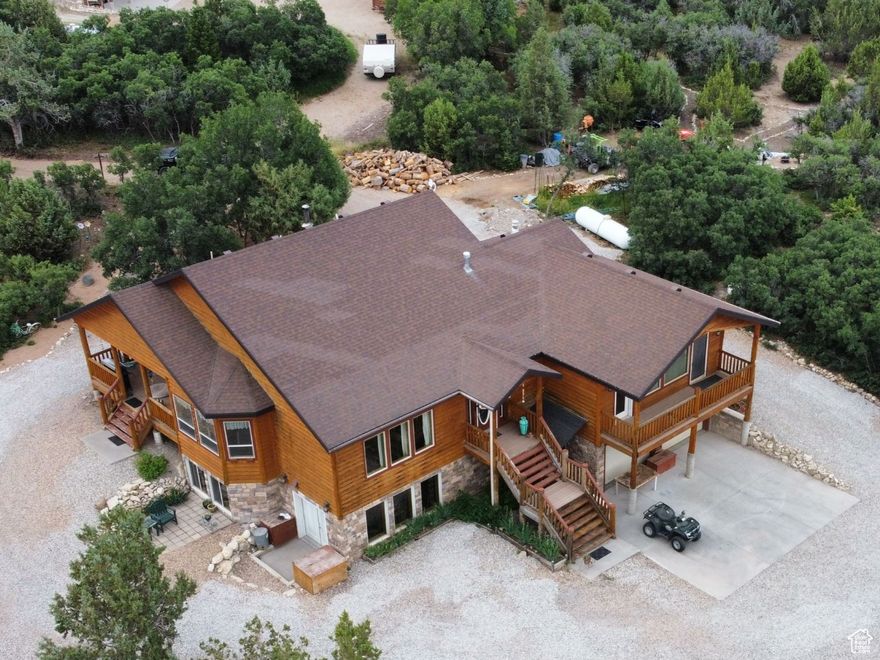 Tucked away in the beautiful Whispering Pines gated community, just outside Mt. Pleasant, this spacious cabin-style home offers year-round access and peaceful mountain living.  With 3 large bedrooms, 2.5 bathrooms, and just over 4,000 sq ft of living space, there's plenty of room to spread out-whether it's for weekend getaways or full-time living. Enjoy a deck off the kitchen and a balcony off the main living area, both perfect for soaking in the fresh mountain air and gorgeous views of the Sanpete Valley.  The yard is fully xeriscaped, making it low-maintenance and ideal for the high-desert climate. The exterior was re-stained in 2024, so it's in great shape and ready to enjoy with minimal upkeep.  Water is provided by a community well, and the AC plumbing has already been installed, giving buyers the option to easily add central air. Plus, thanks to the HOA plowing the roads, this property offers year-round access-even in winter.  Looking for more space? There are two additional 1-acre lots for sale on either side of the property-great for extra privacy, a shop, or future plans. This home is the perfect mix of space, comfort, and mountain serenity. Don't miss your chance to own a piece of Whispering Pines-reach out to schedule a showing!  Square footage figures are provided as a courtesy estimate only and were obtained from county .  Buyer is advised to obtain an independent measurement.