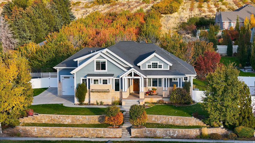 Custom-built and thoughtfully designed, this spacious home captures mountain and sunset views through large, light-filled windows. Every space reflects care and craftsmanship, with quality finishes and thoughtful touches throughout. The heart of the home is an open great room and kitchen, featuring high-end appliances, a gas fireplace, and an easy flow for gathering or entertaining. The main-floor primary suite offers comfort and convenience with a spacious bath, a generous walk-in closet with its own laundry, plus a second laundry downstairs perfectly suited for family living. Set in a wonderful community known for its friendly neighbors and welcoming spirit, this home is as warm and charming as it is functional, crafted for life and lasting memories.  Square footage figures are provided as a courtesy estimate only and were obtained from blueprints.  Buyer is advised to obtain an independent measurement.