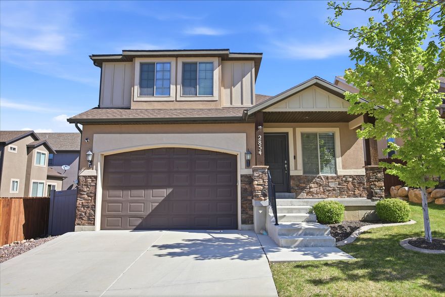 Beautifully updated Traverse Mountain home on a quiet, peaceful street. This light-filled home features vaulted ceilings, an open kitchen and family room, a cozy gas fireplace, and upgraded finishes throughout that give the home a clean, move-in-ready feel. The kitchen offers granite countertops, stainless steel appliances, a large center island, and an open layout perfect for gathering and entertaining. Upstairs, the spacious master suite includes double vanities, a separate tub and shower, and a walk-in closet. The fully finished basement adds two additional bedrooms, a full bathroom, and a theater-ready setup complete with surround sound speakers. Enjoy the beautifully landscaped backyard featuring mature trees, garden space, two apple trees, a cherry tree, Asian pear tree, grapevines, raspberry and strawberry bushes, and blooming rose bushes that create a peaceful outdoor retreat. The front yard is fully maintained by the HOA. Additional features include whole-house water filtration, water softener, smart thermostat, radon mitigation system, storage shed, and a fully fenced north-facing backyard ideal for shaded summer evenings. Enjoy access to the pool, clubhouse, gym, parks, trails, and all of the highly sought-after Traverse Mountain amenities. Conveniently located near Eagle Summit Park, hiking and biking trails, shopping, dining, and quick freeway access to Silicon Slopes, Salt Lake City, and Provo. Washer, Dryer, and Refrigerator all included. Come see it today!
