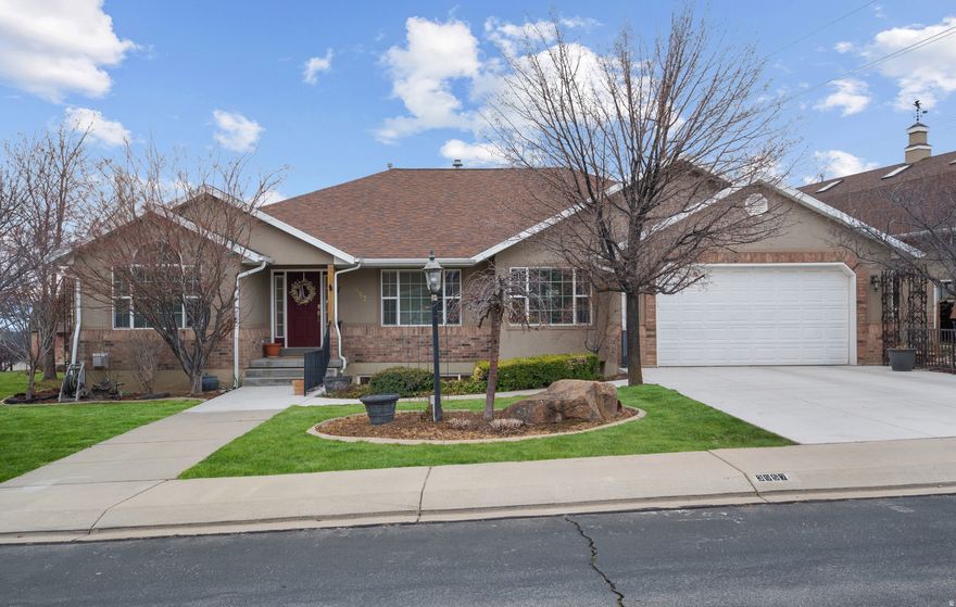 Beautifully maintained custom home in one of Cedar Hills' most desirable, quiet neighborhoods-featuring mountain views, and a serene, park-like setting. The fully landscaped yard includes mature trees, fruit trees, and a charming stream flowing through an intimate garden area between the home and its exceptional detached shop/garage. This standout 2-story, 2,240 sq ft main floor garage/ upstairs shop (28' x 40' footprint) offers a 2-car garage below and versatile upstairs space-perfect for additional shop use, hobby storage, home office, workshop, or future apartment conversion (subject to permits). Dedicated RV parking makes this one-of-a-kind property ideal for hobbyists, collectors, mechanics, or anyone needing serious storage and workspace. Inside, an open, entertaining-friendly layout features a spacious family room flowing seamlessly from the kitchen and dining area. The kitchen opens to a generous deck-great for BBQs and enjoying spectacular sunsets. The luxurious owner's suite is privately located at the rear with direct deck access, complemented by a home office, guest bedroom, full bath, laundry, and half bath on the main level. The fully finished basement provides incredible versatility: a second full kitchen, family room, three additional bedrooms, full bath, dedicated gym, and another half bath-ideal for multigenerational living, guests, in-law suite, or recreation. Dual water heaters ensure you'll always have a hot shower. Prime location: minutes from Heritage Park, Harvey Park, and the scenic Cedar Hills Trail connecting to the renowned Cedar Hills Golf Course. Multiple parks, trails, and community amenities support an active, family-oriented vibe, with shopping, restaurants, and conveniences nearby. This rare blend of luxury, functionality, and unmatched outbuilding potential in a highly sought-after Cedar Hills spot won't last long.  Square footage to be verified by Buyer.