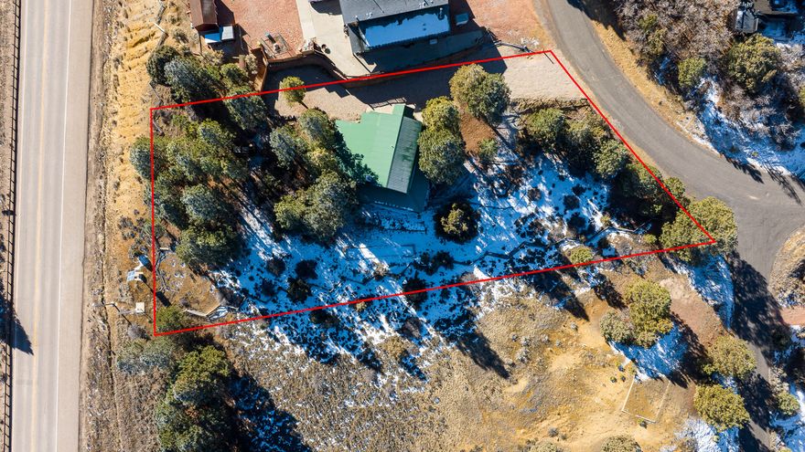 Step into a mountain retreat that blends comfort, charm, and incredible space. This beautiful cabin offers 7 bedrooms and 5 baths, giving everyone plenty of room to spread out and enjoy the surroundings. From the moment you arrive, the sweeping mountain views-framed perfectly from the broad, covered decks-set the tone for relaxation. The main-level suite provides easy living, complete with its own office and an airy loft that can flex to your needs. The kitchen has been thoughtfully refreshed with stylish new countertops, modern luxury vinyl flooring, and plush new carpet adds warmth throughout. Outdoors, the property shines as a gathering place. Spend your afternoons around the fire pit, enjoy a friendly game of horseshoes, or unwind in the hot tub under the stars. The generous decks invite summer lounging, while the wood-burning fireplace creates the coziest winter escape. This cabin is offered fully furnished with a compelling offer, making it truly move-in ready. For those eyeing investment potential, its 7yr history as a short-term rental speaks for itself-with an impressive collection of more than 150 positive reviews. A perfect 2nd home or an investment! Buyer to verify all.