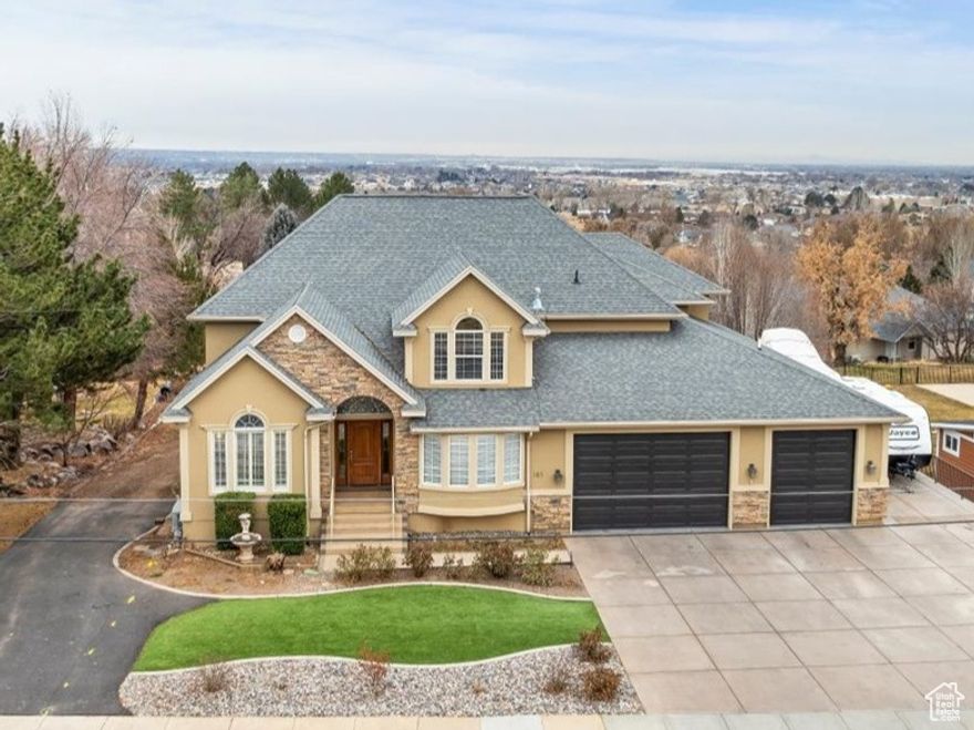 BEST VALUE ON THE MARKET!!!  ACT NOW BEFORE THIS OPPORTUNITY IS GONE!   This beautiful NORTH OGDEN home has it all! Breathtaking MOUNTAIN and VALLEY views, incredible amenities including 2 covered decks, 1 covered patio, large surround sound theater room, 7 car garage with RV capacity and so much more!  This also has the potential of a mother-in-law, basement apartment with a separate basement entrance and roughed in plus plumbing for a kitchen. The bright, open kitchen features a double wall oven, built-in microwave, gas stove, and spacious island overlooking the dining and great room-perfect for entertaining plus additional space in the formal dining room that offers flexibility as a home office, library, or music room. Upstairs, the master suite is a dream retreat!! The grand master bedroom features a tray ceiling and flows seamlessly into the spa-like master bath, complete with a double sink vanity, soaking tub, walk-in tiled shower, and an extra-large walk-in closet.  Don't MISS OUT on the garage of your dreams!  A true 7 car capacity with high ceilings and  epoxy floors workshop area, plenty of shelving and mudroom area! It's a must see in person to appreciate the size and capacity! Movie lovers will enjoy the full surround-sound theater, while outdoor enthusiasts will appreciate the private backyard with newly updated landscaping! With so much to offer you won't ever need to leave home!   Located just a short walk from The Barn Golf Club and White Barn Country Club, with easy access to parks, trails, Highway 89, and I-15, this home is less than 30 minutes from two ski resorts and 15 minutes from Willard Bay. Whether you're seeking luxury, comfort, or adventure, this home is a must-see!