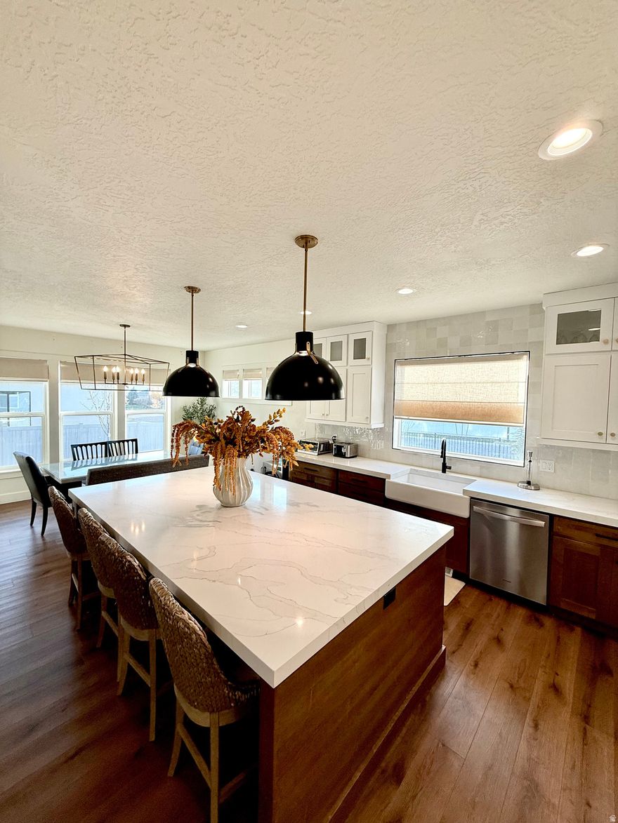 Large family home in a highly sought after neighborhood.  Fully custom landscaping with garden.  This is not a spec home as every color, finish, and modification were carefully chosen.  Lots of extra's like real stone, RV pad and garden, walk in butler pantry, fully finished basement with walk out and stairs outside,  roman shades, permanent lighting, newly resurfaced RV pad, home gym, upgraded finishes throughout, upstair loft,  huge oversized Island in the kitchen, laundry room just outside of the main floor master bedroom, with custom master closet and much more.   Square footage figures are provided as a courtesy estimate only and were obtained from ______________ .  Buyer is advised to obtain an independent measurement.