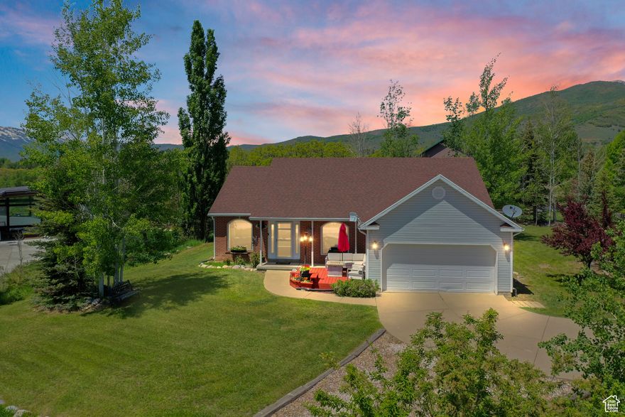 Beautifully maintained mountain rambler home with views of the Ogden Valley and Pineview Reservoir. Located on an elevated corner lot on dead end street with a forest like backyard for privacy and wildlife viewing. Home features vaulted ceilings, gas fireplace, hardwood floors upstairs, updated kitchen, crown molding, formal dining and eat in kitchen as well as 4 bedrooms plus a bonus room that could be used as a 5th bedroom. Office can be converted back into bedroom. The furnace, roof and water heater were all updated in the last 6-7 years. Enjoy the views off of the back patio or newer redwood deck in front. Close to world class skiing Snowbasin and Powder Mountain and only an hour away from Salt Lake City. Furnishings are negotiable! Buyer to verify all information.