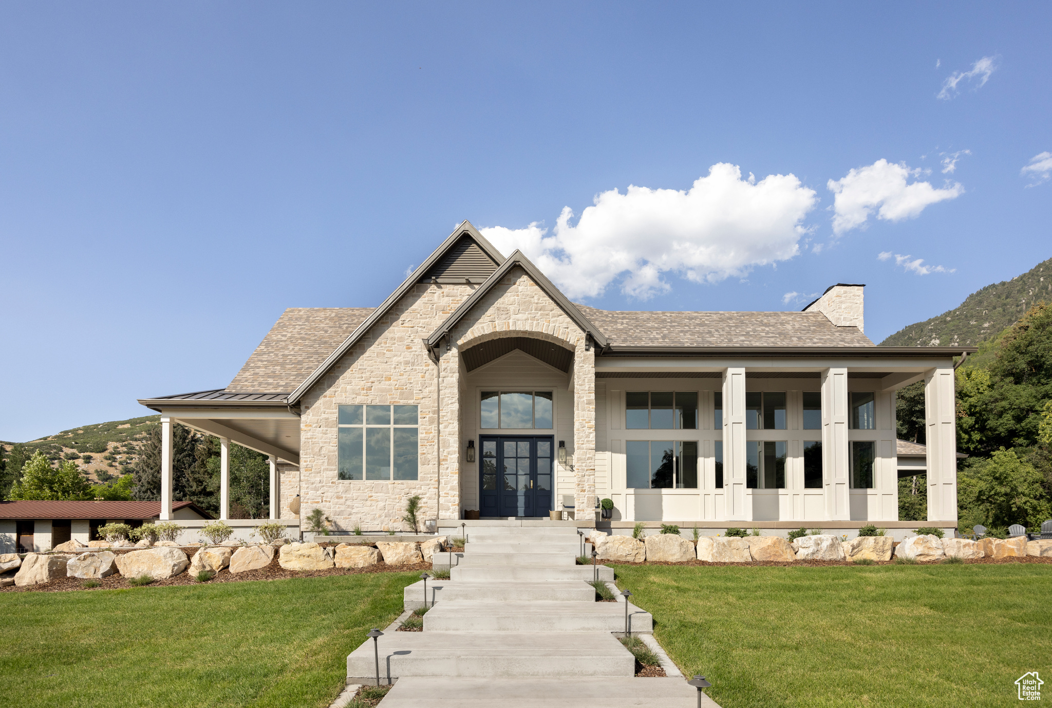 STUNNING 2025 UTAH PARADE OF HOMES ESTATE | PREMIER EAST BENCH LOCATION Price: $3,990,000 Unparalleled Mountain Living on 1 Full Acre | 3303 E Lone Springs Cv, Sandy Experience the pinnacle of luxury living in this breathtaking new construction home, perfectly positioned on a full acre in Sandy's coveted east bench. With panoramic Wasatch Mountain views and just minutes from world-class skiing at Snowbird and Alta, this exceptional estate offers the ultimate Utah lifestyle. PROPERTY HIGHLIGHTS: 3,409 sq ft main level living + 4,213 sq ft finished basement (91.5% finished (646 sq ft of unfinished cold storage)) 5 bedrooms, 6 bathrooms total 3-car attached garage with additional driveway parking 2025 new construction with premium finishes throughout Spectacular mountain views from multiple vantage points Full-acre lot with 30+ mature trees and endless possibilities for outdoor amenities Full landscaping and an exterior gas fire pit MAIN LEVEL FEATURES: Luxurious master suite with spa-inspired bathroom Gourmet kitchen with high-end appliances, butler's pantry Sophisticated home office perfect for remote work Open-concept family room with soaring ceilings (10'+ throughout, 14' vaulted areas) Formal dining room for elegant entertaining Mudroom with custom built-in lockers Multiple covered porches for outdoor living Outdoor kitchen with a built-in barbecue Expansive windows and timeless finishes LOWER LEVEL PARADISE: State-of-the-art theater room for cinema experiences Dedicated AV room/media space 10' ceilings throughout Home gym Full second kitchen Second family room/recreation space Three bedrooms and three full bathrooms + one half bathroom Loads of cold storage space EXCEPTIONAL DEVELOPMENT POTENTIAL: This expansive one-acre lot offers remarkable opportunities to create your ultimate outdoor entertainment experiences: Ample space for a pickleball court Perfect setting for a luxury swimming pool with stunning mountain views Room for a detached garage for your car collection or RV storage Ideal spot for a pool house to maximize gathering and entertainment experiences Create the outdoor oasis of your dreams while maintaining privacy UNIQUE NEIGHBORHOOD CHARACTER: Live next to one of Sandy's most charming attractions - the beloved neighborhood goats! These playful personalities have become local celebrities with their entertaining antics, rock climbing adventures, and spirited head-butting games. A delightful feature that adds authentic mountain character to this prestigious location - a perfect conversation starter for your guests! PRIME LOCATION: 3 minutes to Little Cottonwood Canyon Quick access to Snowbird & Alta ski resorts Near Bell Canyon & Rocky Mouth Falls trailheads Close to Hidden Valley & Willow Creek Country Clubs Adjacent to Dimple Dell Regional Park Easy access to I-215 for downtown Salt Lake City and Park City THE ULTIMATE UTAH LIFESTYLE AWAITS Take advantage of this unique location to create your dream estate in a neighborhood with unique character. Wake up to stunning mountain views and the occasional entertainment from your famous goat neighbors, hit the slopes within minutes, or enjoy a morning game of pickleball in your own backyard. Host unforgettable pool parties with the Wasatch Mountains as your backdrop, then retreat to your private theater for movie night. The possibilities are endless on this exceptional property. Estimated completion: end of July 2025 Don't miss this rare opportunity to own a brand-new luxury estate with unlimited potential in one of Sandy's most prestigious and character-filled neighborhoods. Schedule your exclusive showing today and start envisioning your dream outdoor paradise! Square footage figures are provided as a courtesy estimate only and were obtained from the home builder's plans. Buyer is advised to obtain an independent measurement.