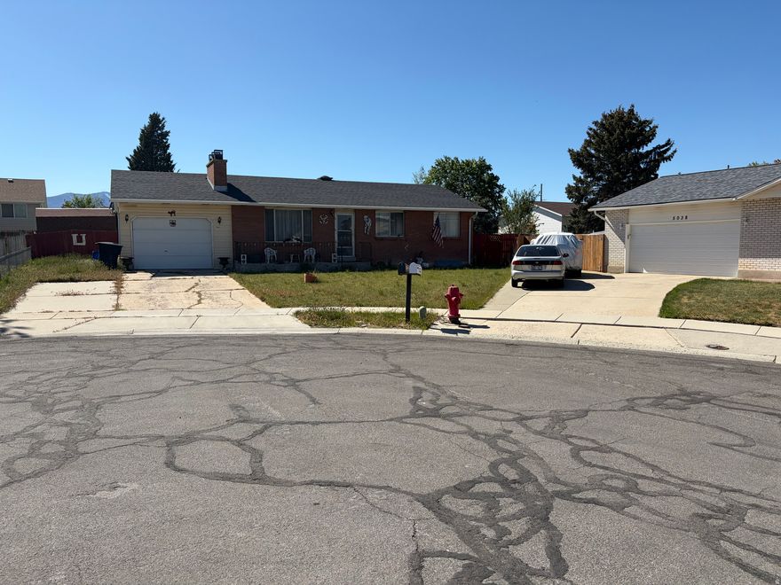 No showings until OPEN HOUSE on Saturday, May 9th from 11 AM to 2 PM. Strategically located on a cul-de-sac, this house features several nice amenities such as: original hardwood floors, newer roof, soffit, fascia, and gutters, new furnace and A/C unit in 2024, and a pull through garage. This is an estate sale and, as such, offers great potential as a DIY project or fixer upper. Needs TLC and is sold AS-IS. CASH only. Buyer to remove debris and personal belongings once the property is vacated. Have your contractors ready and complete bids before making offer. Earnest money is hard upon acceptance.