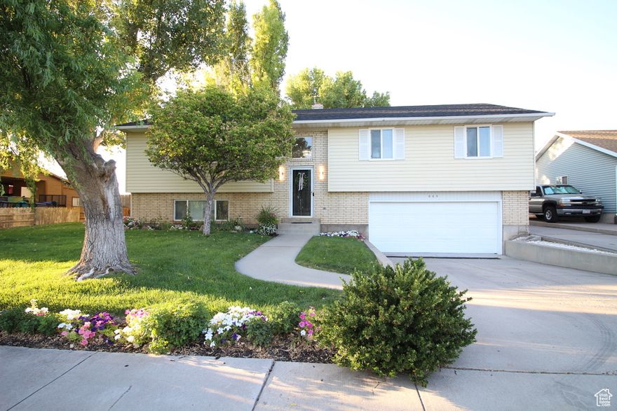 MUST SEE!! Immaculate, exceptionally updated home in a highly desirable location. Every inch of this move-in ready home has been upgraded. Enjoy all-new luxury vinyl plank flooring in the kitchen, great room, hallways and laundry room, beautiful tile bathrooms, and luxury carpet. The kitchen has been fully transformed with modern, upgraded quartz countertops, an oversized island, custom cabinetry, under-cabinet lighting and a deep dish sink. The open living space provides a seamless flow for everyday living and entertaining. Additional upgrades include a new roof, windows, water heater, and lighting throughout the home. Enjoy the peaceful deck and patio areas, complete with an outdoor fire table and seating area that overlook a beautiful park.  Privacy fenced, manicured yard, mature trees, garden area, and wired for a hot tub. Detached shed and extra parking pad. (Plumbing available for third bathroom downstairs.) Schedule your tour today!   Square footage figures are provided as a courtesy estimate only and were obtained from measurement .  Buyer is advised to obtain an independent measurement.
