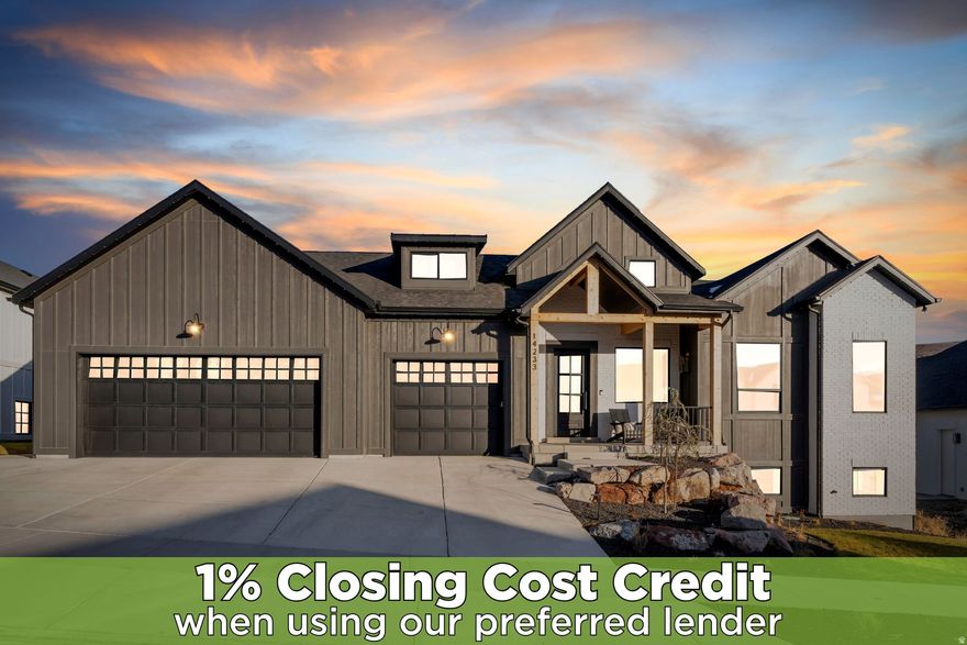 LOCATION, LOCATION, LOCATION! Experience Herriman's breathtaking scenery in this home boasting true single-level living and absolutely breathtaking panoramic mountain views via the expansive windows in every room! The heart of the home is the custom two-tone Kitchen, thoughtfully designed with stainless steel appliances, an expansive island and a hidden butler's pantry complete with a dry bar - perfect for entertaining. The adjacent dining area showcases chic suspended lighting and gorgeous views to the mountains, while the family room includes a striking feature wall with a built-in gas-log fireplace! The main floor primary suite is a true retreat with vaulted ceilings, a spa-inspired ensuite bathroom featuring a large soaking tub, an oversized Euro shower with marble tile, and a spacious walk-in closet designed for effortless organization. Additionally, the main floor includes a custom, oversized laundry room showcasing ample space for organizing, sorting and storing your laundry and other personal belongings. The walkout basement includes an expansive family room, a kitchenette, 3 Bedrooms, two additional  baths with custom tile Euro showers, along with one unfinished bedroom with plumbing in place for an ensuite bathroom and slider doors accessing a 2nd walkout entrance! The layout is ideal for a possible ADU, multi-generational living, investment opportunity, or simply to entertain guests. Step outside to the expansive wrap-around deck, where unobstructed mountain and valley views create the perfect backdrop for relaxing or entertaining. Schedule an opportunity to come see this stunning Herriman home today!