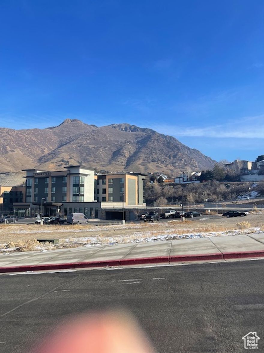 Preliminary Approval for 4 story building with 22,233 sq ft of commerical and 65,318 sq ft of residential. Great opportunity for luxury condos.  Unparalleled location at mouth of Big Cottowood Canyon with easy access to skiing and recreation. Located next to new Courtyard by Marriott Hotel and Eight Settlers Restaurant.  Parking structure already complete and included in the price.  Ample available parking.  Building will be built on top of existing parking structure. Conceptual architectural drawings complete.