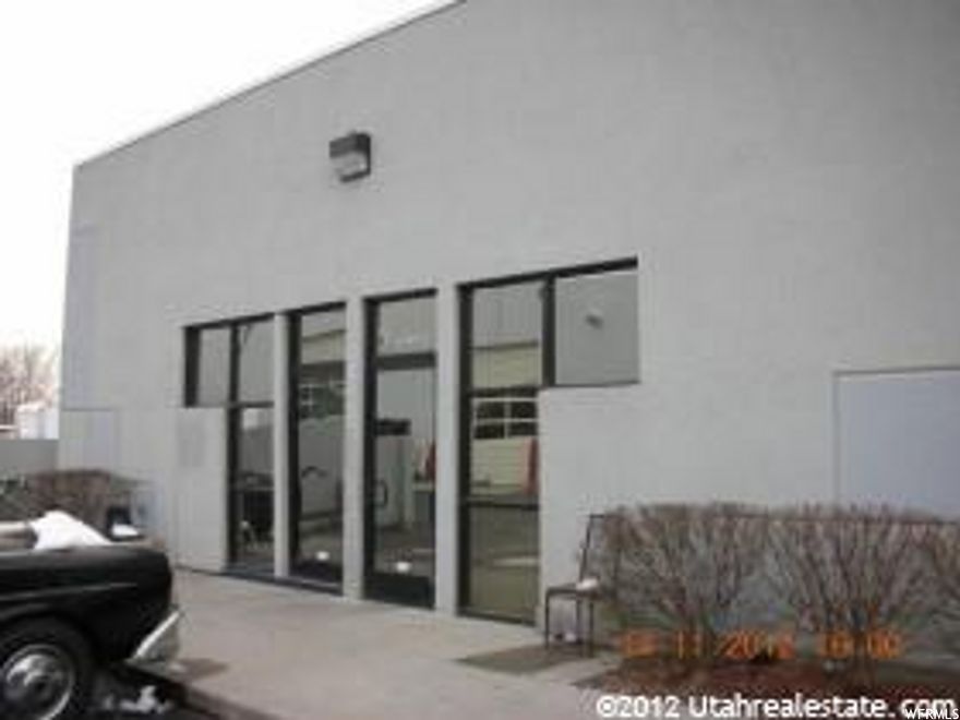 Fantastic Warehouse space just off State street and 8000 south.   Double doors open up wide to drive in vehicle or forklifts  Large Mezzanine.  Was used as an automotive shop for many years.   Come down and check out this great Condo.