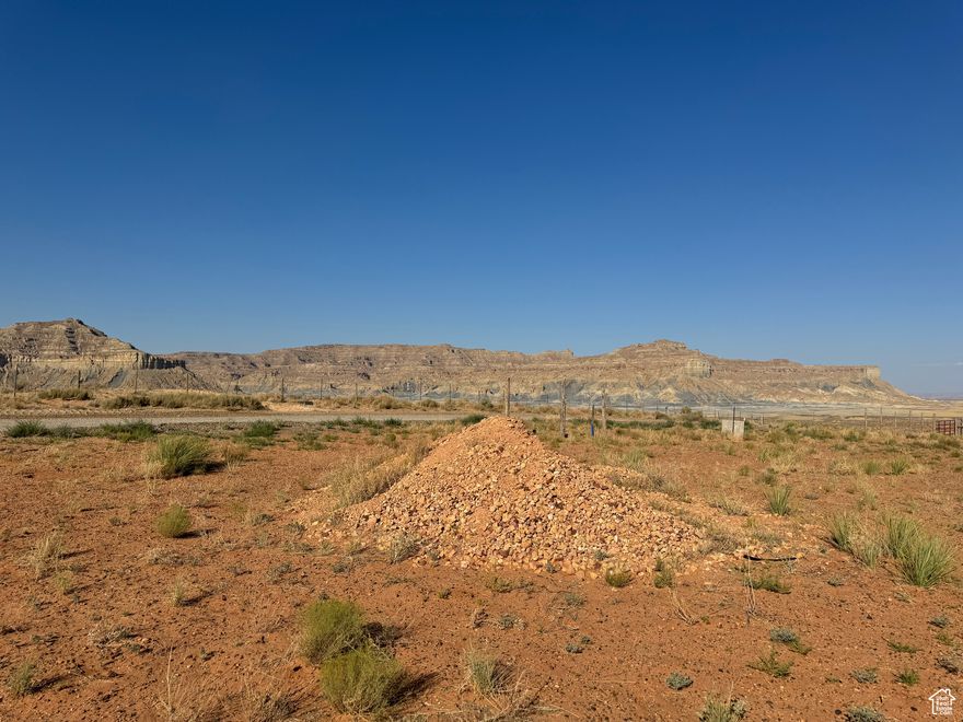 Come check out this commercial buildable lot.  This lot is designed for commercial use,  apartments and more.  Call the planning and zoning department to confirm your dream plans for your build.  This lot has great view of the bluffs and Lake Powell while being located just off of the highway for great visibility.