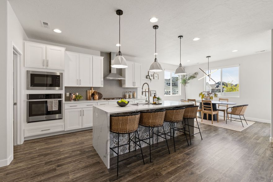 **Open House Saturday, April 18 from 11:00 - 1:00** Welcome to this beautifully maintained home in the highly sought-after Still Water community in Syracuse-where pride of ownership truly shines throughout. Just shy of 2,800 sq ft, this home offers a functional and thoughtfully upgraded open layout designed for both everyday living and entertaining. The main level features durable LVP flooring throughout and a private enclosed office, perfect for working from home. The kitchen is a standout with a stunning waterfall quartz island, upgraded cabinetry with soft-close drawers and cabinets, a gas countertop range with a modern hood, and plenty of space to gather. Additional upgrades include a fully built-out laundry room, tankless water heater, and PAID OFF solar providing both convenience and long-term energy savings. Step outside to enjoy a custom pergola covering the back patio creating the perfect space for relaxing or hosting. The extra-deep garage offers ample room for vehicles, storage, or recreational gear. Located just moments from the community pool and gym, this home also benefits from exciting growth in the area including a new Costco anticipated to open in Syracuse this summer and the brand-new Still Water Elementary School scheduled to welcome students this fall. Don't miss your opportunity to own a move-in-ready home with quality upgrades and true pride of ownership in Still Water!