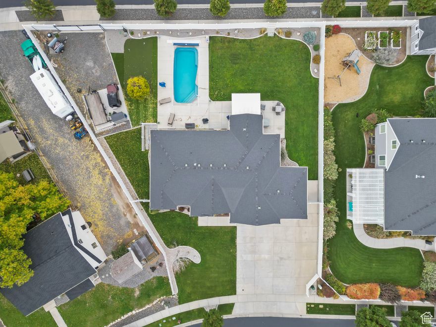 Spacious single-level rambler offering an ideal blend of comfort and sophistication! This home features 5 spacious bedrooms and 3 full bathrooms, with 3 bedrooms and 2 baths on the main level and 2 bedrooms, 1 bath, and a large living room in the fully finished basement - perfect for versatile living or guest accommodations. Enjoy two inviting living areas that create seamless flow for entertaining or relaxation. The three-car garage provides ample space for storage and vehicles, while the 48-foot gated parking pad in the backyard easily accommodates RVs, boats, and recreational toys.  Step outside to your private backyard retreat complete with a built-in BBQ station, inground pool, and personal putting green - ideal for outdoor entertaining and leisure. Situated on over one-third of an acre, this property offers both space and privacy in a highly desirable neighborhood.