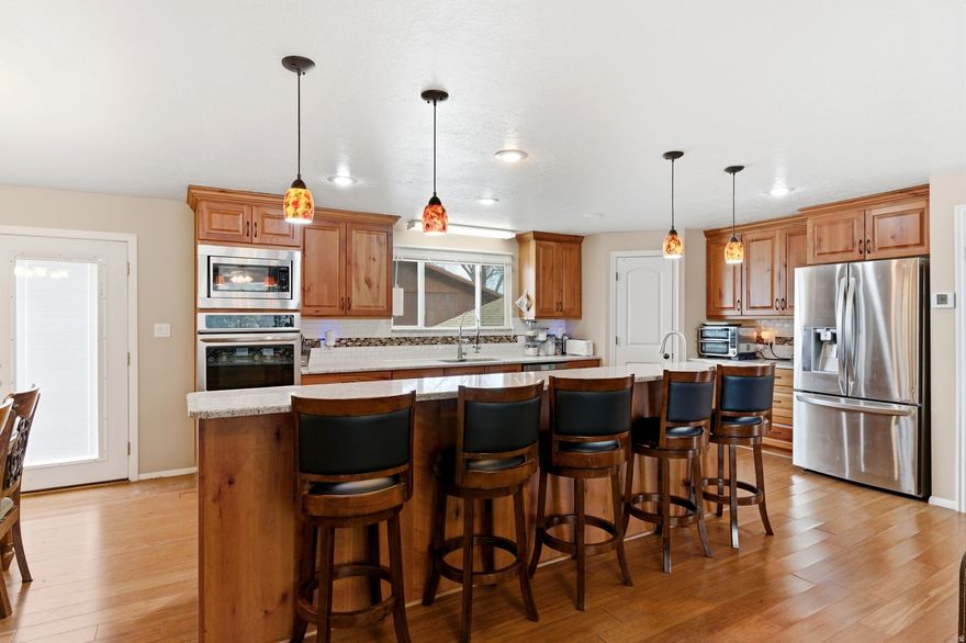 Welcome to this spacious South Ogden home with great mountian views. This home has 4 bedroom, 3 and a half bathrooms. It has 3 living spaces plus a sun room. Laundry is on the main floor. All the bathrooms as well as the kitchen have been updated in the last 5-10 years. The kitchen has an 11 ft island with granite countertops and cherry cabinets. It has solar panels that are paid for and a new roof added at the same time. Furnace and air conditioning condenser are less than 10 years old. Water heater was replaced last year. A deck was added about 7 years ago. The deck was built with Trex boards great for summer BBQs. Basement is 100% complete. Located close to two main hospitals, shopping centers, Weber State University with great access to 89 & HAFB.