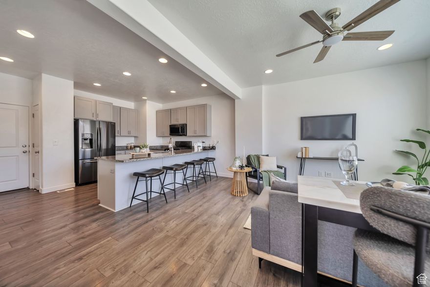 This beautiful townhome end unit is move-in ready and offers 3 bedrooms and 2 baths. Newly painted and has tons of natural light. The main floor features an open concept living area with lots of natural light. The kitchen is nicely appointed with white shaker cabinets, quartz countertops and stainless appliances. The well thought-out design provides ample storage with walk-in and several storage closets. You can enjoy the community swimming pool across just down the street along with picnic and playground areas. You don't want to miss this spotless home with quick and easy access to I-15, Redwood Road and Mountain View Corridor.