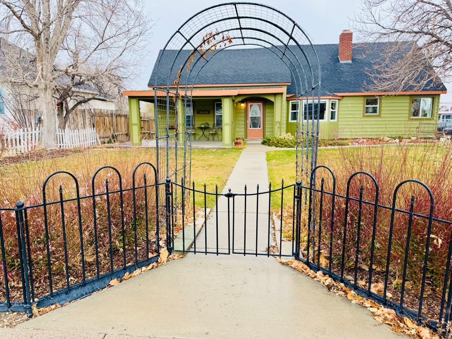 Beautifully updated home with timeless vintage charm. Enjoy peace of mind with a new roof, new furnace, and new A/C unit, along with newer flooring throughout the main level. The spacious covered front porch and large back deck overlook lush summertime flowers, creating a warm and inviting outdoor space. Inside, a cozy wood-burning fireplace anchors the home during winter months.An oversized two-car garage offers added storage and workspace, all situated on a generous -acre lot.