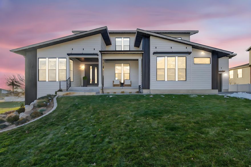 This beautifully custom-built home checks all the boxes.. Designed with both everyday living and entertaining in mind, the open main level is bright, welcoming, and full of natural light. The kitchen is a standout with a large island, modern finishes, and plenty of room to gather. The primary suite feels like a true retreat with a spacious layout, a gorgeous bathroom, and a walk-in closet. Additional bedrooms are generously sized and thoughtfully laid out. Downstairs, the fully finished basement offers a complete second living space, including a full kitchen and an additional primary suite-perfect for guests, extended family, or multi-generational living. The basement is open, comfortable, and just as nicely finished as the main level. Step outside to enjoy multiple outdoor spaces, including a covered deck and patio where you can take in the mountain views and enjoy Utah sunsets. The yard is functional and private, with room to relax, entertain, or make it your own. A true custom home with flexible living options, quality finishes throughout, and views that never get old-this one is a must-see. This yard is POOL ready also!, they haver stubbed the plumbing for an outdoor shower!