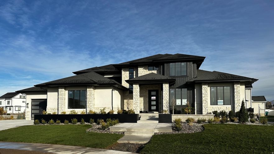 LOT#8. This Symphony Homes Forte XL plan is a dream! Expected to be complete November 2025. The BEST of everything between upgrades and designer touches! Huge kitchen has two kitchen islands, a large walk in pantry with countertop, gas cooktop range, double wall ovens, fridge and freezer, and 2nd sink! Enormous laundry room with tons of cabinets and a sink. Stunning primary suite with modern bathroom that feels like a spa, and walk-in closet that's its own room with a window and custom built-ins! Upper level catwalk overlooks entry and great room. All bedrooms are oversized. The finished basement boasts an open game/theater, gym, and wet bar with it's own entry! Large covered deck, or patio below is the best place to enjoy a shady evening and mountain views.