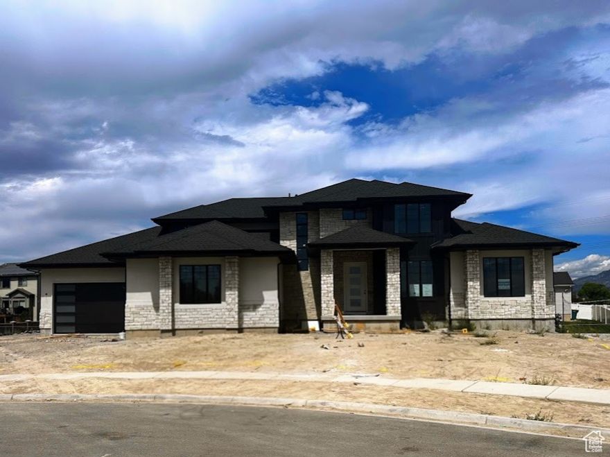 LOT#8. This Symphony Homes Forte XL plan is a dream! Expected to be complete November 2025. The BEST of everything between upgrades and designer touches! Huge kitchen has two kitchen islands, a large walk in pantry with countertop, gas cooktop range, double wall ovens, fridge and freezer, and 2nd sink! Enormous laundry room with tons of cabinets and a sink. Stunning primary suite with modern bathroom that feels like a spa, and walk-in closet that's its own room with a window and custom built-ins! Upper level catwalk overlooks entry and great room. All bedrooms are oversized. The finished basement boasts an open game/theater, gym, and wet bar with it's own entry! Large covered deck, or patio below is the best place to enjoy a shady evening and mountain views.
