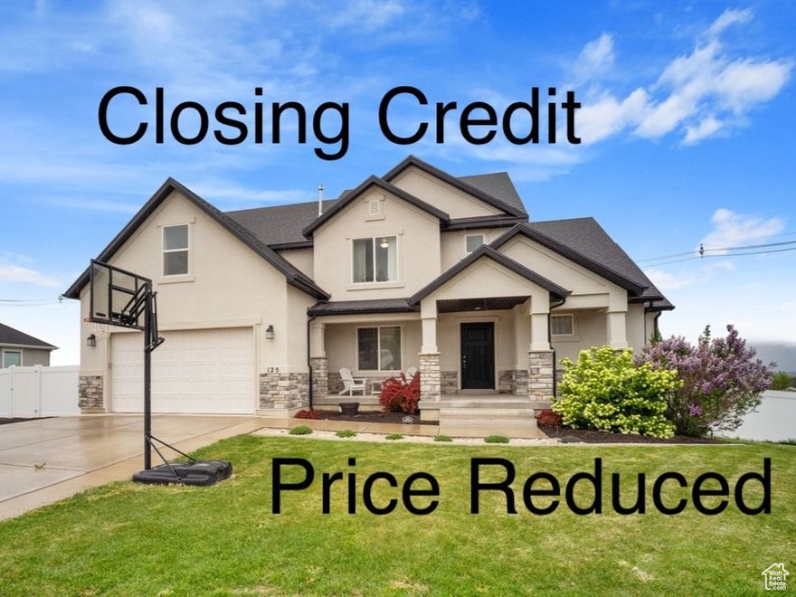 ($20,000 Closing Credit for closing costs, a rate buydown or for customizing the home to your taste) Welcome to this beautifully maintained 6-bedroom, 4.5-bathroom home, on the border of Elk Ridge and Salem, perfectly situated to capture breathtaking mountain views to the south and sweeping valley views to the north. This home is better than new, with a finished basement and fenced and landscaped yard! An added bonus is the separate basement apartment complete with its own kitchen, laundry, and private entrance-ideal for guests, extended family, or rental income. (The whole walk-out basement could be a 3 bedroom apartment or  divided and used as a separate studio apartment) Conveniently located on the border of Salem and Elk Ridge. This spacious and inviting residence offers thoughtful design, modern comforts, and exceptional outdoor living spaces. The main floor features a large great room with soaring picture windows, a cozy fireplace, and seamless flow into the large kitchen and dining area-ideal for entertaining (don't miss the big bonus 2nd pantry). The main-level primary suite boasts a spa-like ensuite with a separate tub and shower, plus a generous walk-in closet. A versatile front room provides the perfect space for a home office or music room. You can step out onto the deck and enjoy panoramic views-perfect for relaxing or hosting guests. Upstairs, you'll find three well-sized bedrooms, a full bathroom, and a spacious game room over the garage. The fully finished walk-out basement offers even more living space with a large recreation room, two additional bedrooms, a full bathroom and huge warm and cold storage rooms.  You'll love the fully fenced backyard, complete with a covered patio, gazebo, fire pit, and a secret garden featuring 9 raised garden beds with drip irrigation-an oasis for garden enthusiasts. This home truly offers space, functionality, and beauty both inside and out.