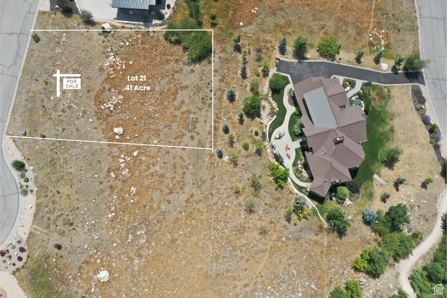 Extend Your Mountain Retreat in the Highlands at Wolf Creek. This lot is being sold with first right of refusal to the buyer of 5652 E Porcupine Ridge Dr, offering a rare opportunity. Nestled on a quiet cul-de-sac in the prestigious Highlands at Wolf Creek, this .41-acre elevated site offers panoramic views of Snowbasin, Pineview Reservoir, and the Ogden Valley. Scenic walking trails are just steps away, and year-round adventure awaits with world-class skiing at Powder Mountain and Snowbasin Resort minutes from your door, plus hiking, biking, and water sports nearby. Water and sewer connection/impact fees have not been paid and geo study has not been completed.  Establish your legacy property and create your dream mountain getaway in one of Eden's most sought-after neighborhoods.