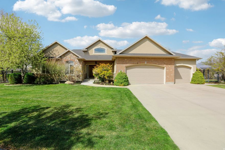 GRAND OPENING | OPEN HOUSE | APRIL 11 | Beautifully updated rambler in a quiet Draper neighborhood, directly across from a 4-acre park with stunning mountain views! Step inside to brand new LVP flooring and carpet, fresh paint, updated lighting, and a remodeled hall bath. The inviting layout features a spacious primary ensuite with a relaxing jetted tub, a cozy gas fireplace in the family room, and a welcoming sitting room at the entry-perfect for a home office or flex space. Downstairs offers a large open family room and a separate entrance to a mother-in-law apartment, providing flexibility for guests or income producing potential. Enjoy outdoor living with a brand new concrete patio and updated front steps, plus added peace of mind with a radon mitigation system already installed. A move-in ready home in a peaceful setting-this one is a must see! Buyer to verify all information.