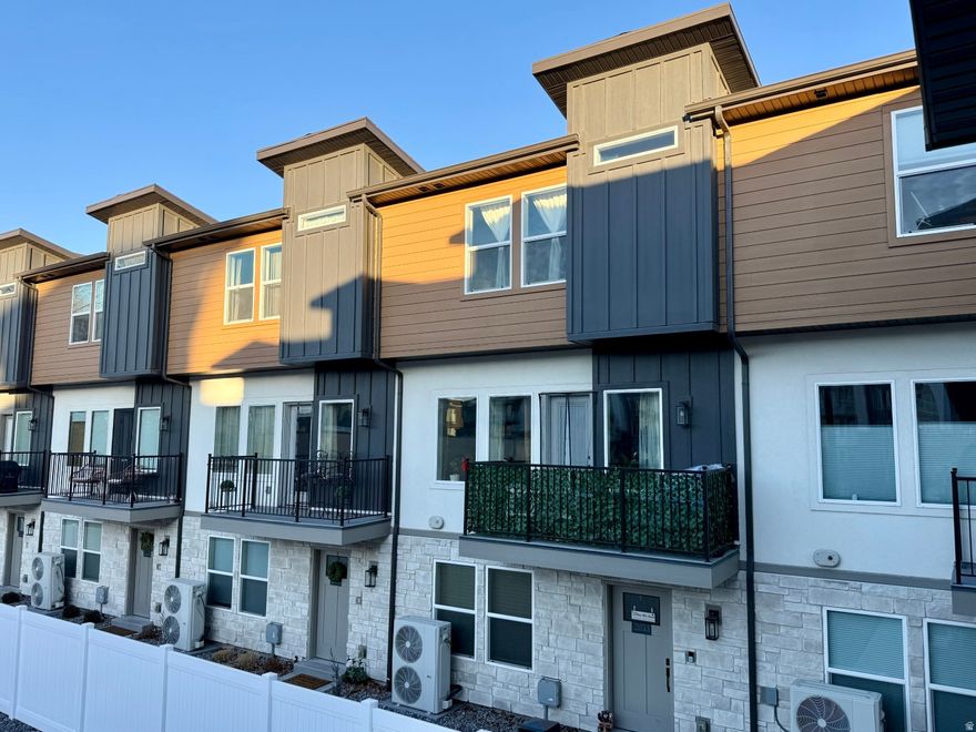 Built in 2024, this light-filled 4-bedroom, 2.5-bath end-unit townhome offers 1,609 sq ft of modern design, thoughtful upgrades, and exceptional convenience in the heart of Midvale.  Oversized windows fill the home with spectacular natural light, creating a bright and welcoming atmosphere throughout all three levels. The open-concept kitchen is designed for both entertaining and everyday living, featuring a gas range, 42" upper cabinets, a large island, and 3cm quartz countertops throughout.  The bottom-floor bedroom offers flexible space perfect for a home office, gym, gaming room (with dedicated fiber optic line run directly to the garage), guest room, or additional storage. With HOA-covered internet, connectivity and convenience are built in.  Upstairs, the spacious primary suite includes a walk-in closet and private bath with double vanity and Moen fixtures. Two additional bedrooms, a full bath, and a dedicated laundry room complete the upper level.  Additional highlights include:  End-unit privacy with extra natural light  Epoxy-coated 2-car garage floor  Upgraded belt-drive smart garage door opener with keypad  Gas line for BBQ  Water recirculation system (no waiting for hot water)  Quartz countertops throughout  Community gated area for dogs  Located in walking distance from the TRAX station, commuting is effortless. You're within 2 miles of Gardner Village, Fashion Place Mall, and Bingham Junction (WinCo, Topgolf, and dozens of restaurants), less than half a mile from Midvale City Park with pickleball courts, splash pad, disc golf, playground, and amphitheater, and just a 3-minute drive to historic downtown Midvale.