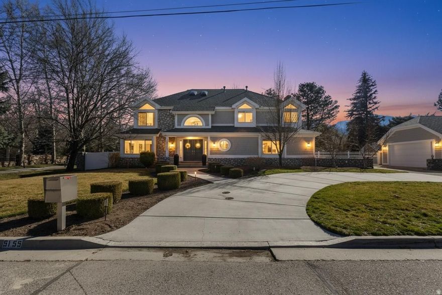 **This home to be featured on ABC4's Real Estate Essentials** Tucked away in one of Holladay's most desirable settings, this stunning estate offers a rare blend of privacy, nature, and convenience. Set on a beautifully landscaped .35-acre lot, the property is surrounded by mature trees, breathtaking mountain views, and the peaceful sound of a creek flowing through the backyard creating a tranquil retreat just minutes from the city.  With 4,757 square feet, this spacious home features 7 bedrooms and 3.5 bathrooms, offering exceptional flexibility for both everyday living and entertaining. Inside, you'll find rich hardwood flooring, granite countertops, crown molding, and elegant two-tone paint, creating a warm and refined atmosphere throughout the home.  The primary suite is a standout, featuring rare double walk-in closets and a comfortable private retreat feel. Modern comforts include two furnaces, two air conditioning units, and a brand new water heater, providing efficiency and year round comfort.  Step outside to enjoy the expansive deck overlooking the lush backyard, where the natural landscape, mature trees, and flowing creek create a peaceful outdoor oasis perfect for relaxing or gathering with friends and family.  Adding to the home's appeal is a four car garage, a convenient horseshoe driveway, and an incredible location where you can walk to nearby restaurants.  Homes that combine space, scenery, walkability, and location like this rarely come available in Holladay.  Square footage figures are provided as a courtesy estimate only and were obtained from county records.  Buyer is advised to obtain an independent measurement.