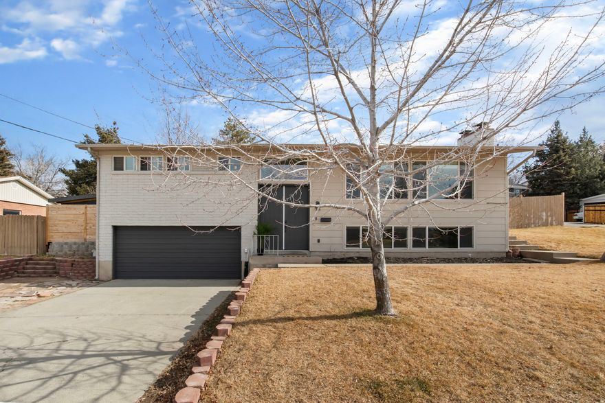 Located in a highly desirable east-side Sandy neighborhood, this home offers flexibility, character, and space in all the right places. The main level features an open kitchen and living area filled with natural light, creating a bright and welcoming feel. A beautiful gas fireplace anchors the upstairs living room and adds warmth and charm. With a separate basement entrance, washer and dryer hookups both upstairs and downstairs, and plumbing and electrical already in place for a future downstairs kitchen, the home is well-suited for multi-generational living, rental potential, or a possible ADU setup IF desired. Or just keep it as-is and enjoy the updated home to yourself. Situated on a generously sized lot, the yard provides plenty of room to relax, entertain, garden, and play. Enjoy the strong location, functional layout, and built-in versatility as a standout opportunity in one of Sandy's most sought-after neighborhoods.