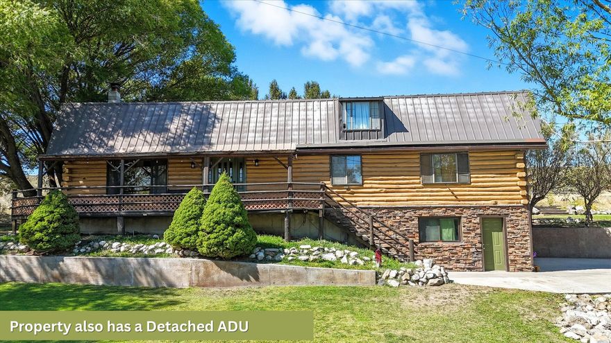 Discover the perfect blend of rustic charm and modern versatility with this one-of-a-kind property.  Nestled on a spacious private lot with breathtaking valley and Mountain Views.  This estate offers a stunning 3,3035 sq ft cabin in addition to a detached 900 square foot approved ADU.  There is an additional 900 square foot multi-use are above the ADU with a separate entrance. Main cabin highlights:  vaulted ceilings and expansive living spaces, updated kitchen with custom cabinetry and premium finishes.  Luxurious master bath, featuring a jetted-tub and beautiful flooring throughout for a warm, inviting feel.  The ADU features a large main bedroom with walk-in closet, living room, full kitchen and 3/4 bath.  The multi-use area located upstairs of the ADU has a separate entrance, open concept room, kitchenette and half bath (plumbed for shower).  ADU has an independent propane tank and septic system. This building also features a covered parking area.  Outdoor amenities include a fully landscaped yard with mature trees and fruit trees.  There are two natural springs with water rights included.  It is fully fenced perfect for pets, horses or livestock.  There is also potential to subdivide.  Whether you are looking for a peaceful escape, multi-generational living setup, extra rental income, or a savvy investment opportunity, this property delivers unmatched flexibility and natural beauty.    Square footage figures are provided as a courtesy estimate only and were obtained from previous MLS listing.  Buyer is advised to obtain an independent measurement.  Home shown to qualified buyers by appointment only.