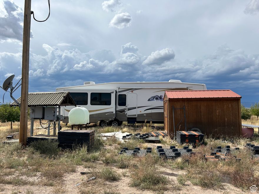 This is 19.6 acres with an apple orchard, over 200 trees. The property comes with 2 acre feet of water rights, a well, and drip system for watering the trees. The RV Trailer is included. There is a storage shed on the property and full electric hookup. There are a total of 2 lots that can be subdivided. The zoning is R1. The property has easy year round county road access. No CCR's or HOA. Located on county road in Escalante Valley Ranchos just off of Hwy 56. Don't delay come see today!