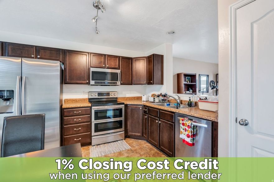 Welcome to this desirable end-unit row townhouse located in a gated community in Salt Lake City, offering both privacy and convenience just minutes from shopping, dining, and downtown.  This well-designed home features two spacious bedrooms and two full bathrooms upstairs, including a primary suite with vaulted ceilings and large windows that fill the space with natural light. The thoughtful layout creates a bright and comfortable retreat.  The kitchen is both stylish and functional, showcasing rich, dark cabinetry paired with stainless steel appliances, perfect for everyday living and entertaining. Just off the main living area, enjoy a private patio ideal for al fresco dining, relaxing, or grilling.  As an end unit, this home benefits from added privacy and a bit more breathing room. The gated community also features a playground, offering a great space for outdoor enjoyment.  With its prime location, inviting layout, and low-maintenance living, this townhouse is a fantastic opportunity to enjoy the best of Salt Lake City living.