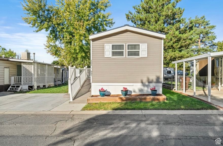 Welcome to this stunning 3-bedroom, 2-bath home featuring an inviting open layout, modern updates throughout, and new carpet.  The spacious master suite includes a full ensuite bath for added privacy and comfort.  Enjoy cooking and entertaining in the beautifully updated kitchen, which flows seamlessly into a large living area perfect for family gatherings or relaxing evenings.  Step outside onto the new trex deck, ideal for outdoor dining or simply enjoying the sunshine.  Located directly across from a community park and ample parking, this home offers both convenience and charm.  Residents also enjoy access to a pool and clubhouse, making this an exceptional place to call home!