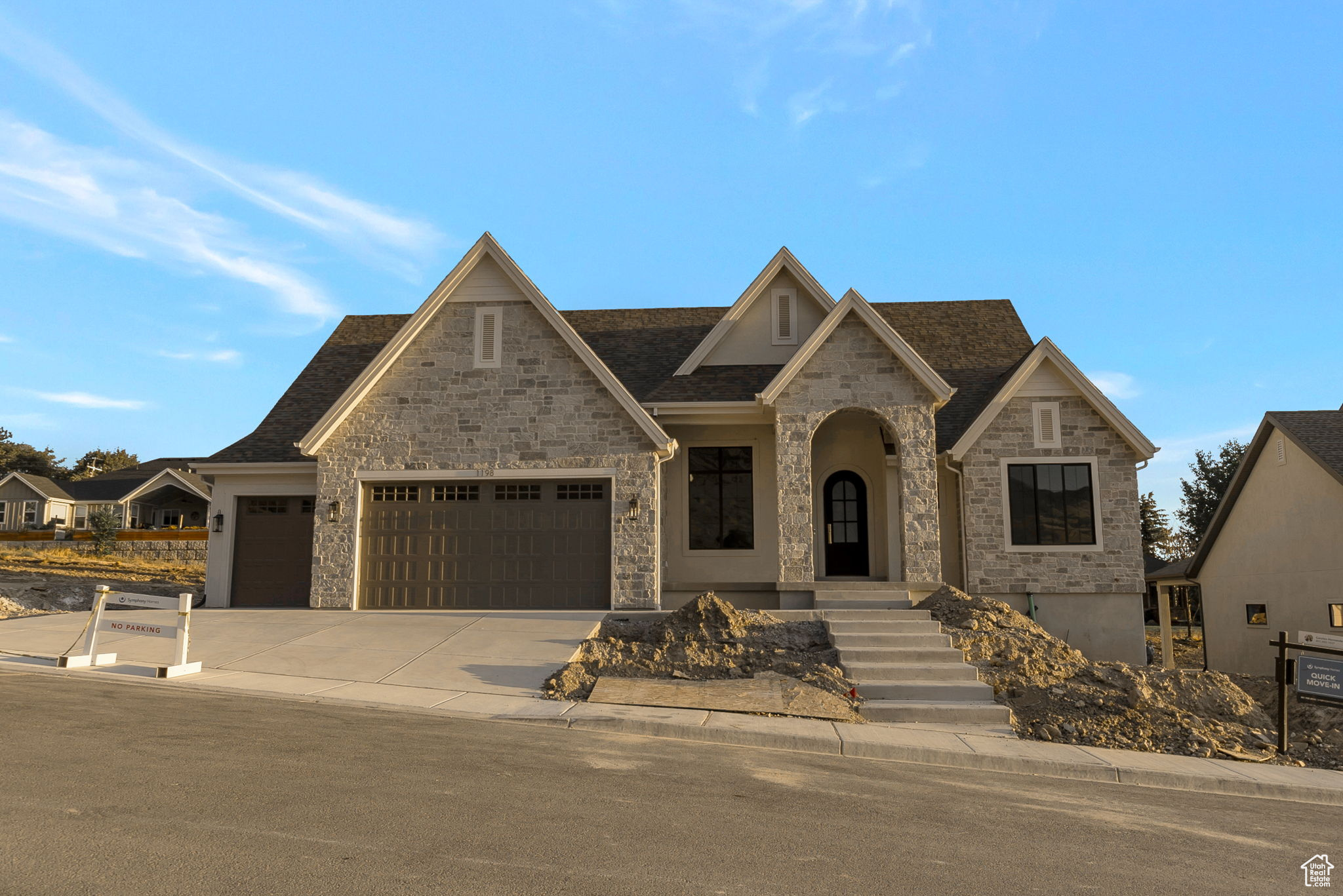 LOT#119 in Symphony Homes' Blossom Hills community. This beautifully crafted 'Octave' plan blends a thoughtful floorplan, design, and high-end finishes. Enjoy stunning interior details like custom millwork in the flex room, finish carpentry around the fireplace, and ceiling beams in the family room for added charm. The kitchen features premium ZLINE appliances, including a 48" dual fuel range w/ 7 burners, a fridge/freezer combo, and a butler's pantry with countertop and outlets. Unique "pocket office" adjacent to kitchen. The main-floor primary suite includes a freestanding tub and a large custom walk-in closet. The 2nd bedroom on the main level features an en-suite bathroom. Mudroom with built-in lockers adds everyday convenience. The finished basement includes a spacious family area, wet bar, cold cellar, 9' foundation walls, and plenty of storage. A covered patio and fully landscaped yard complete this exceptional home. Price includes full landscaping which is expected to be completed by late October.