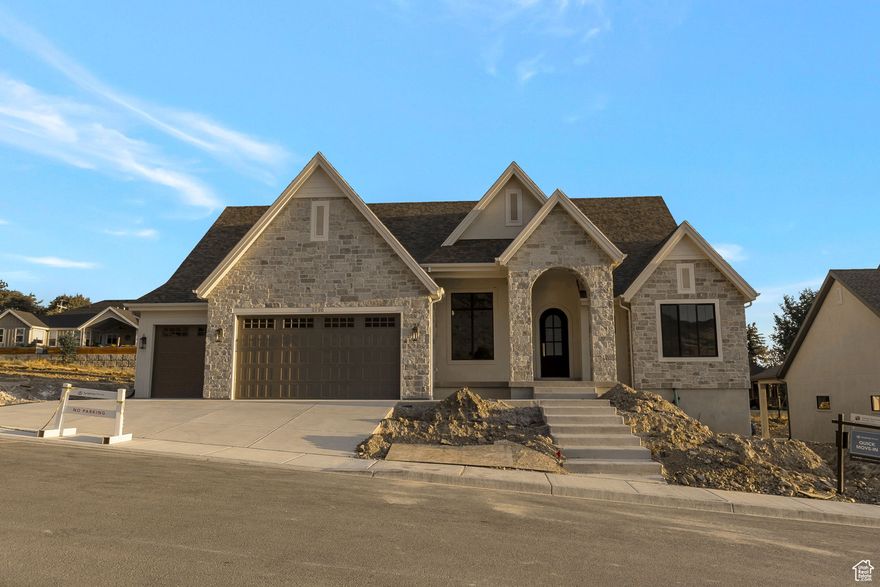 LOT#119 in Symphony Homes' Blossom Hills community. This beautifully crafted 'Octave' plan blends a thoughtful floorplan, design, and high-end finishes. Enjoy stunning interior details like custom millwork in the flex room, finish carpentry around the fireplace, and ceiling beams in the family room for added charm. The kitchen features premium ZLINE appliances, including a 48" dual fuel range w/ 7 burners, a fridge/freezer combo, and a butler's pantry with countertop and outlets. Unique "pocket office" adjacent to kitchen. The main-floor primary suite includes a freestanding tub and a large custom walk-in closet. The 2nd bedroom on the main level features an en-suite bathroom. Mudroom with built-in lockers adds everyday convenience. The finished basement includes a spacious family area, wet bar, cold cellar, 9' foundation walls, and plenty of storage. A covered patio and fully landscaped yard complete this exceptional home. Price includes full landscaping which is expected to be completed by late October.