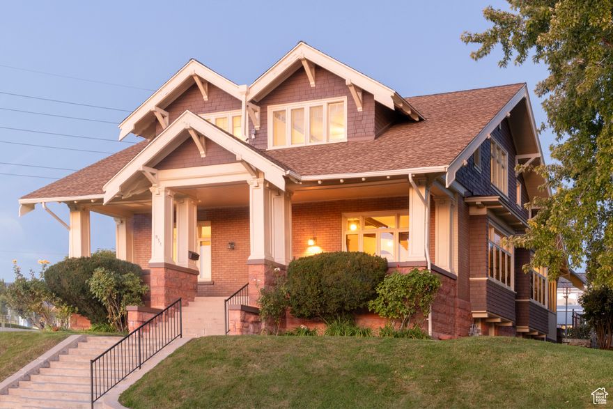 Open Saturday, October 11th, 11:00-1:00 Stately Yalecrest two-story bungalow, filled with character and charm. Huge sitting porch with valley and mountain views. Formal living and dining room with beamed ceiling treatments, original quarter-sawn oak hardwood floors, fireplace, pocket doors, built-in bookshelves and hutch with leaded glass.  Really cool room length window seats, wall treatments, some antique light fixtures, and stained glass. Butler's pantry off the dining room. Eat-in kitchen with a walk-in pantry. Two good-sized bedrooms, a full bath, stackable W/D closet, and a sun porch complete the main floor.  The upper level features three bedrooms, two of which are spacious and include walk-in closets. The third bedroom has a cedar closet,one full bath with a clawfoot tub, and a laundry chute. The lower level adds a laundry and storage area with direct backyard access, plus a  bath, office or study (affectionately known as "The Eagle Room"), two additional bedrooms, and a fruit cellar. Outdoors, enjoy a .25-acre corner lot. The original carriage house has been converted to a two-car garage, and generous off-street parking. A newer roof with a transferable warranty and exterior restoration in 2023, including soffits, cedar shingles, and fresh paint. Located across from East High's track and tennis courts and within walking distance to the vibrant 9th & 9th district, this home offers easy access to the University of Utah, downtown Salt Lake City, hospitals, and nearby canyon recreation and skiing.