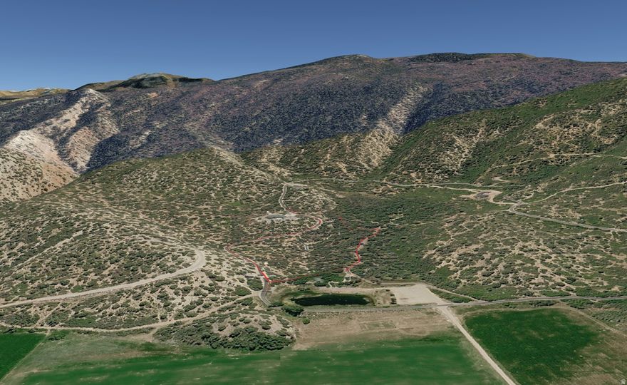 Set on a beautifully positioned 7.43 acres in Horseshoe Mountain Ranch Estates, this exceptional property captures sweeping valley views. The development is backed by expansive BLM land and surrounded by luxury cabins, it offers a rare blend of open space and refined living. Located within a secure, gated community, owners enjoy paved roads, underground utilities, and dedicated culinary water. Community amenities include a private trout lake, sandy beach, pavilion, and thoughtfully maintained common areas-all just southeast of historic Spring City, Utah. This parcel is not subdividable. All information is provided as a courtesy and deemed reliable; buyer and buyer's agent to verify.