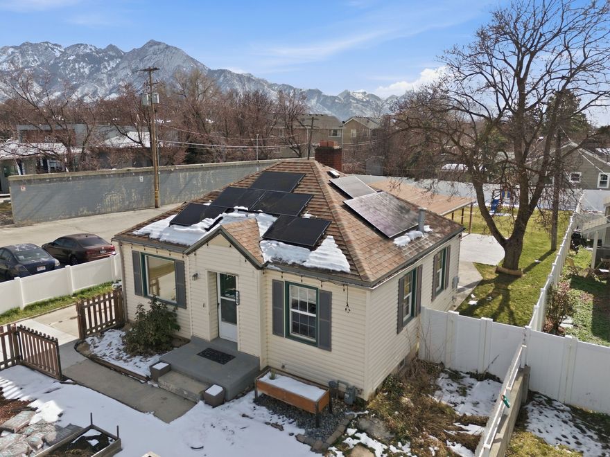 Set in the heart of East Millcreek, this well cared for home offers an ideal blend of everyday functionality, thoughtful updates, and an exceptional location. Paid off solar panels provide long term energy savings, while a 20 by 30 garage plus a two car carport offer outstanding parking, storage, and workspace flexibility. Recent improvements include updated kitchen, bathrooms, water heater, new garage door and more, giving peace of mind to the next owner. The kitchen is both practical and inviting, with all appliances included, a newer refrigerator, and a brand new Bosch dishwasher. Step outside to a large, private backyard that feels tucked away and serene, perfect for entertaining, relaxing, or creating your own outdoor retreat. Exterior lighting adds a fun and modern touch, with color changing options to suit the season or your style. Located just around the corner from Evergreen Park and minutes from Millcreek Canyon, this home offers easy access to hiking, biking, and outdoor adventure. Quick freeway access connects you seamlessly to downtown Salt Lake City, the airport, Park City, and surrounding canyon communities. This East Millcreek home brings together comfort, convenience, and lifestyle in one desirable setting.