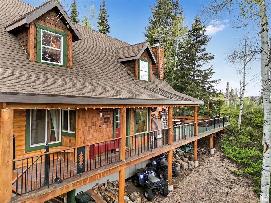 This well-cared for and loved cabin sits in the popular Pine Mountain Subdivision in Weber Canyon, just minutes from Smith and Morehouse Reservoir and the Uinta Mountains - perfect for fishing, hiking, camping, and hunting. Built by the current owner, the cabin features 4 bedrooms, a bunk room, 2 and a half bathrooms, and a vaulted two-story great room with wood-burning fireplace which makes for a perfect place to relax after a day outdoors. The open kitchen flows right into the living space, making it great for gathering with family and friends. There's also a built-in garage for storing 4-wheelers and snowmobiles, and it comes with a highly sought-after storage unit at the bottom of Pine Mountain for extra gear and snowmobiles. Whether you're looking for weekend getaways or a base for outdoor fun, this cabin is move-in ready and ready for summer fun. Use Oakley address with zip code in Google Maps for the correct location. 9281 N Uinta Dr, Oakley, UT 84055.