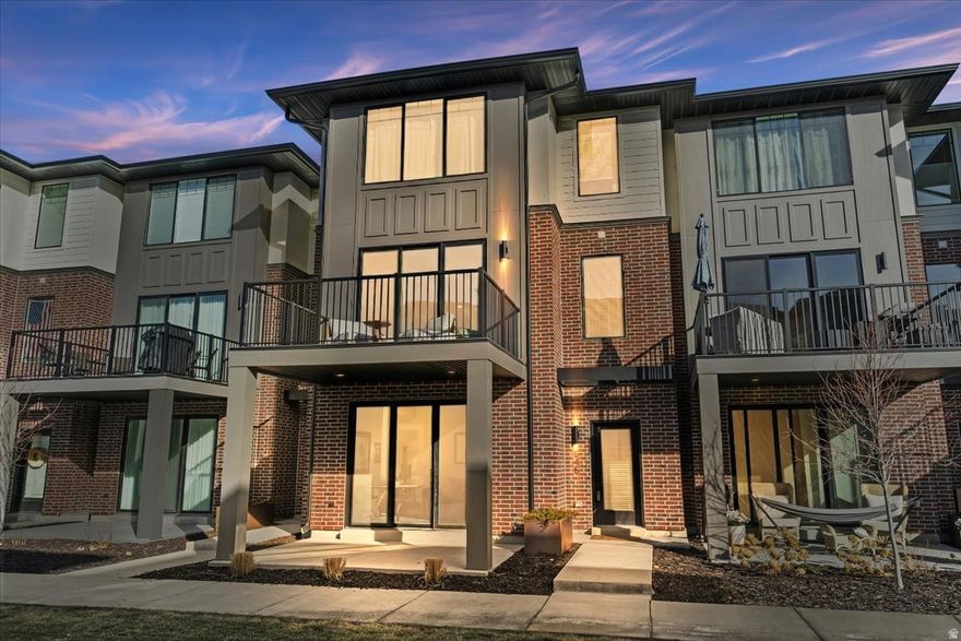 Modern townhome with a perfect layout for today's lifestyle in an unbeatable Ogden location! The main level offers a spacious den/office or flex space with 8' sliders leading to a covered patio. South-facing orientation fills the home with tons of natural light. The main living area features a large dining space, open kitchen, and expansive family room with access to a second deck-ideal for entertaining. Enjoy 9' ceilings throughout, a large walk-in pantry, and an oversized primary suite with double quartz vanities and a walk-in shower. Walking distance to Historic 25th Street, with bars, restaurants, coffee shops, live music, and events-perfect for buyers who want to walk to nightlife, bar hop, catch concerts, and live in the heart of Ogden's energy.