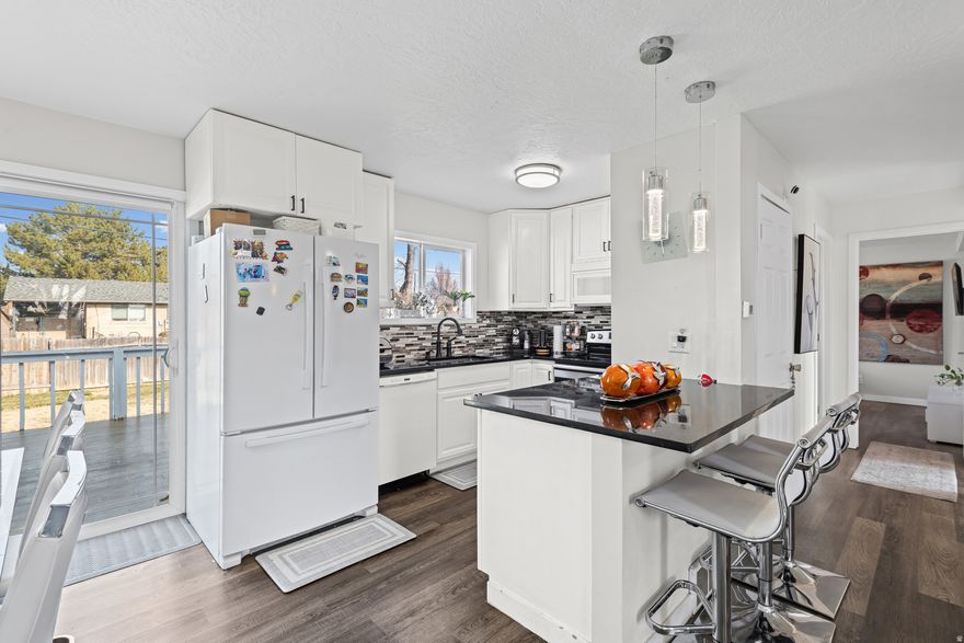 ***10k In seller Credit***  Welcome to this well-located home in Layton offering flexibility, space, and long-term value. One of the standout features is the aluminum roof, known for its durability, long lifespan, and low maintenance, providing added peace of mind for years to come.  The main level offers a functional layout with comfortable living areas, while the basement includes a second kitchen, creating excellent potential for rental income, multi-generational living, or a private guest space.  Conveniently located near schools, shopping, dining, and easy freeway access, this home is a great fit for both homeowners and investors. Whether you're looking for a primary residence with added flexibility or an opportunity with income potential, this property offers solid value in a desirable Layton neighborhood.