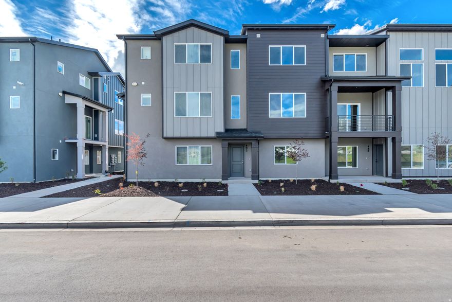 VIEWS & VIEWS!!! Welcome to your brand new Woodside Homes Townhome. This Hillsborough plan is one of the few facing East with amazing Views of Timp.  An office on the first floor is perfect for those working from home, with a spacious second floor great for entertaining. 9' Ceilings on the second floor, upgraded 2-tone cabinetry, with quartz countertops, gas range, waterproof wood laminate flooring, and stained open railing, make this an incredible value you don't want to miss. Dual Sinks in the primary bathroom, with a generously sized walk-in-closet are just a few of the thoughtfully designed features in this home. Located in a highly coveted area in American Fork, close to front runner, freeway access, shopping & more, this is the perfect home for you!  Ask about our AMAZING preferred lender incentives/special rate promotions to help make your dream of homeownership a reality.  #445 Hillsborough. Call/Text Tiffany for more info, or to see this home and others in the community.  801-557-5605