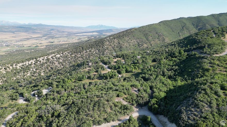 Nestled in the heart of Fairview's breathtaking mountains, this 3.81-acre lot in Legacy Mountain is the perfect canvas for your dream cabin. The lot borders 5 acres of common area. From this vantage point, enjoy unobstructed views of the Sanpete Valley, where every sunset paints the horizon in brilliant hues over Mount Nebo. Mature aspens, maples, and oaks provide natural beauty and privacy, while abundant wildlife-turkeys, deer, and even the occasional moose-adds to the mountain charm.  With power and water available at the road, you can seamlessly bring your vision to life. Legacy Mountain is a gated community dedicated to preserving the mountain experience with residential zoning and well-maintained access. In winter, your escape is still within reach by snowmobile or tracked vehicle, making this a true year-round haven (roads are not plowed).  Whether you crave adventure or serenity, you'll find both here-explore nearby trails for hiking, 4-wheeling, and mountain biking, or enjoy snow sports when the mountains turn white. This is more than land; it's a lifestyle of peace, beauty, and connection to nature.