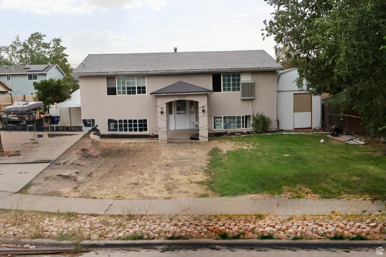 Lovely home with 5 bedrooms, 2 kitchens, 2 laundry, plus the lower level has a daylight basement with additional entrance. Homes needs little work but has tons of potential. Call for a private showing.
